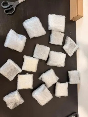 Lights bubble-wrapped for shipping