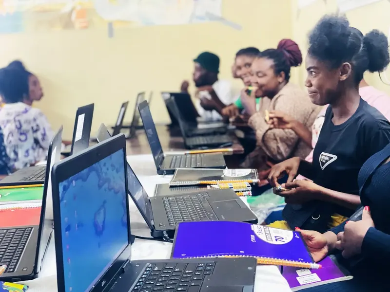 A student using a computer in a Haiti school classroom